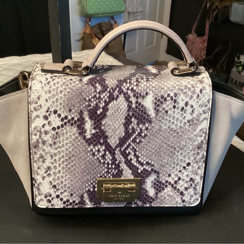 Kate Spade snakeskin and suede crossbody with fold over lock in gold hardware.
